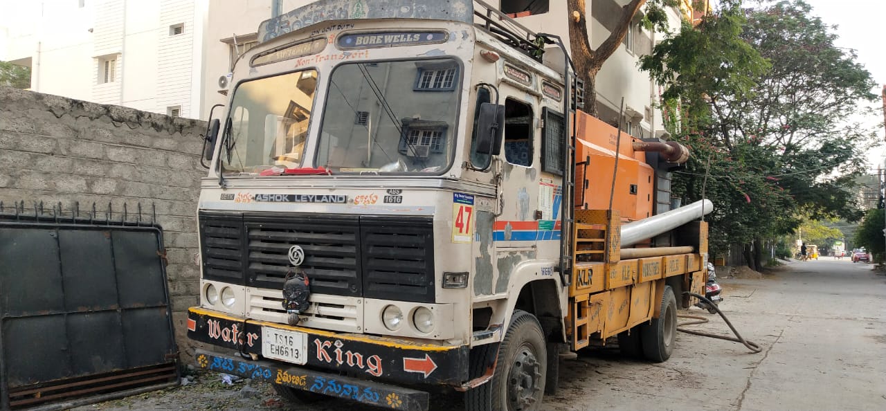 Borewell rig truck parked on a Madhapur street